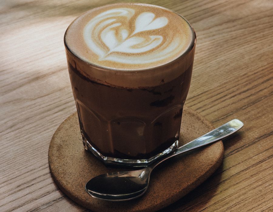 A flat white on the counter