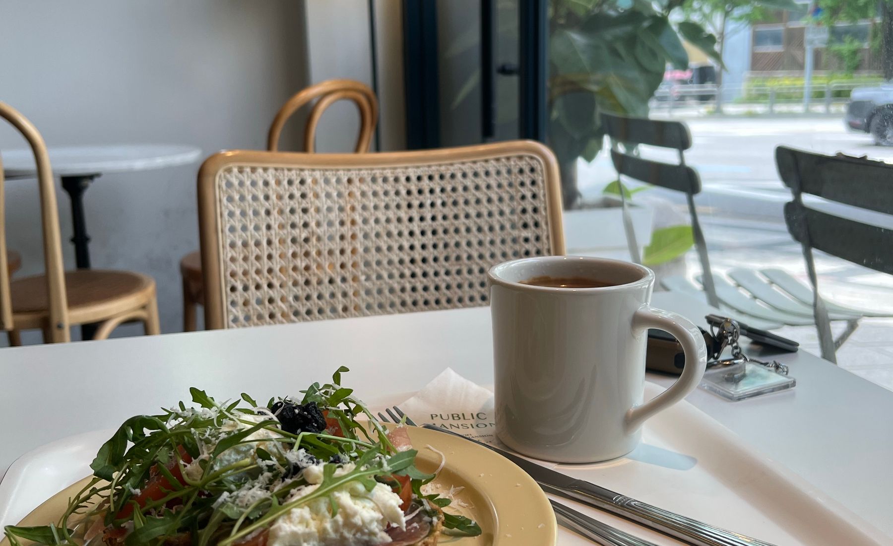 Avocado toast and a cup by the window
