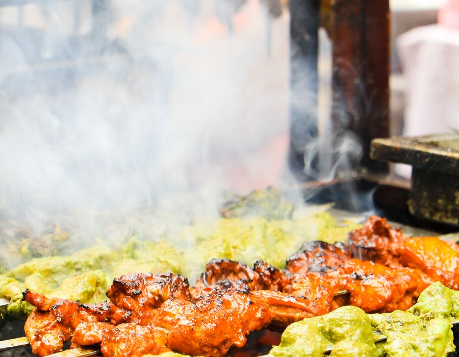 Skewers turning on the street grill