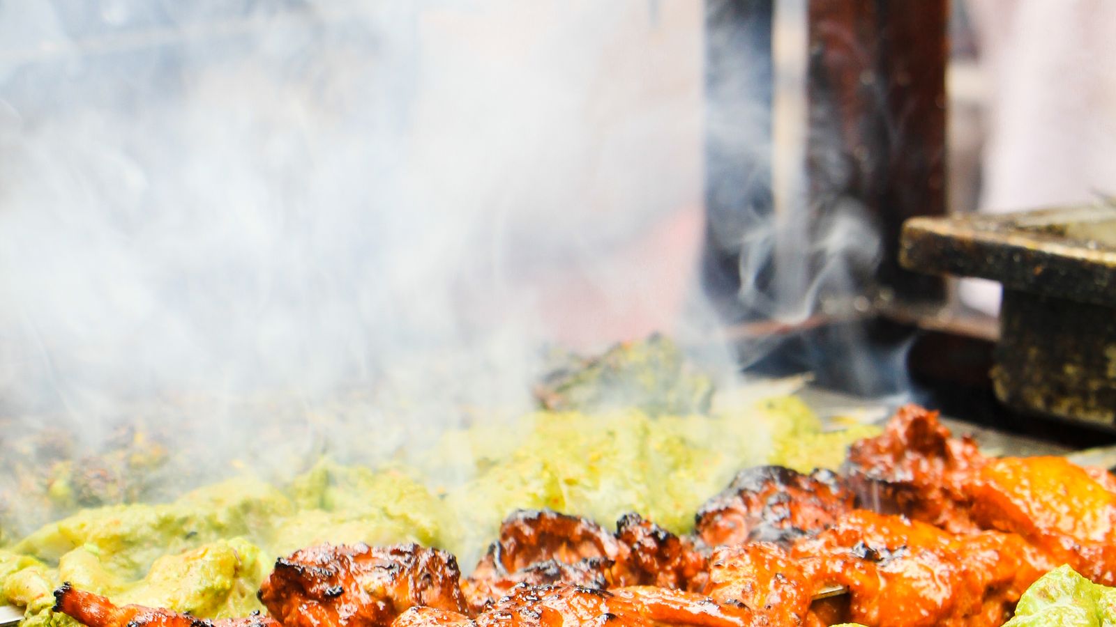 Skewers turning on the street grill