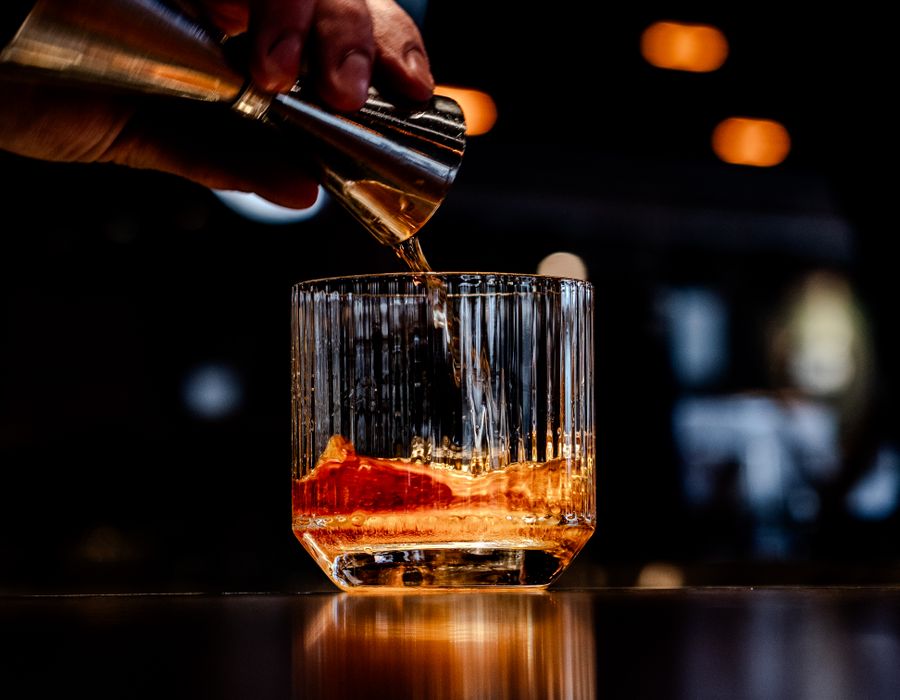 A Coal Old Fashioned being poured