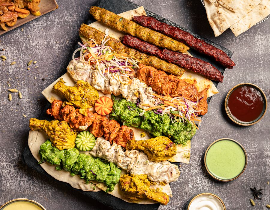 A mixed grill platter with chutneys