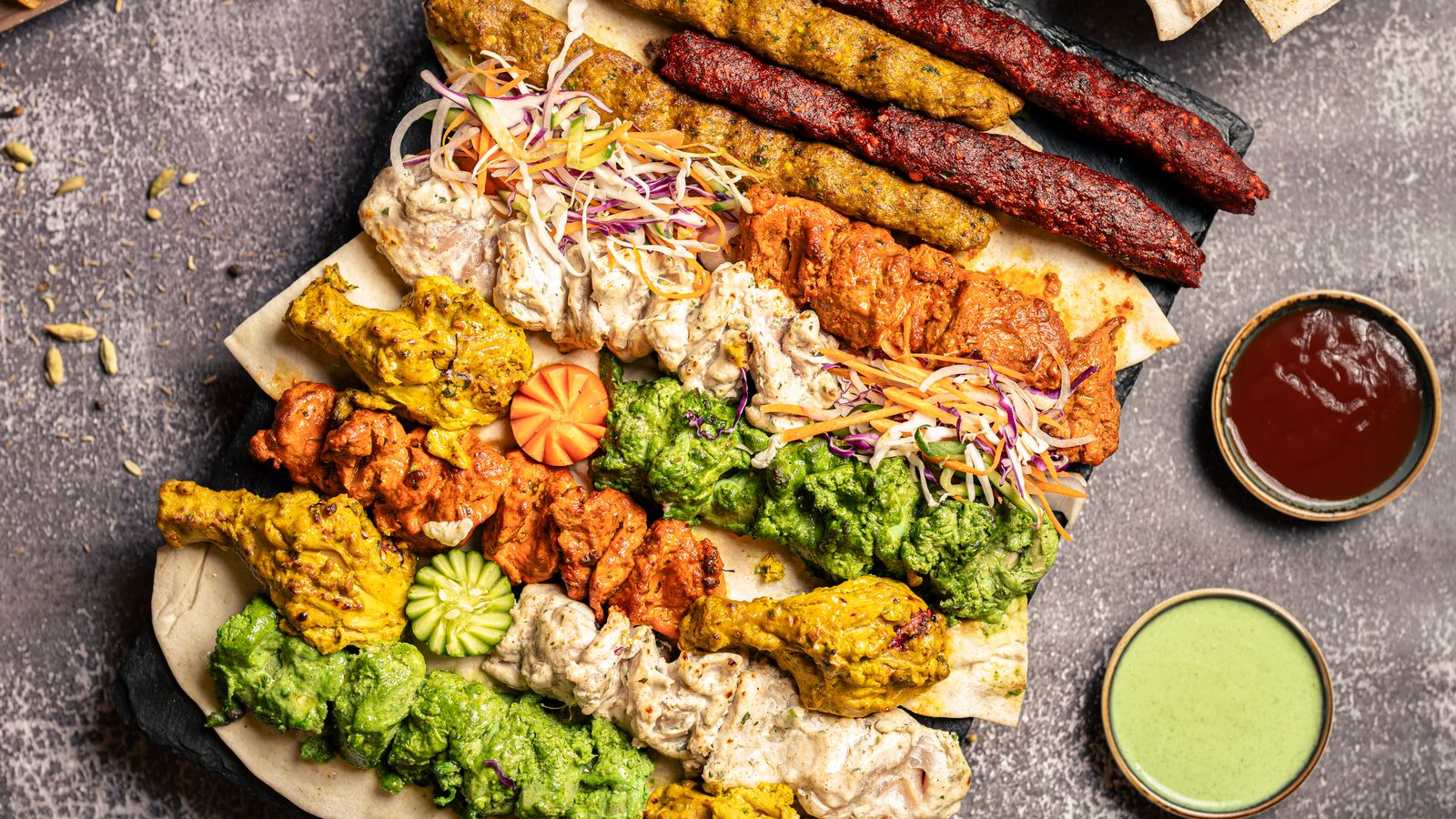 A mixed grill platter with chutneys